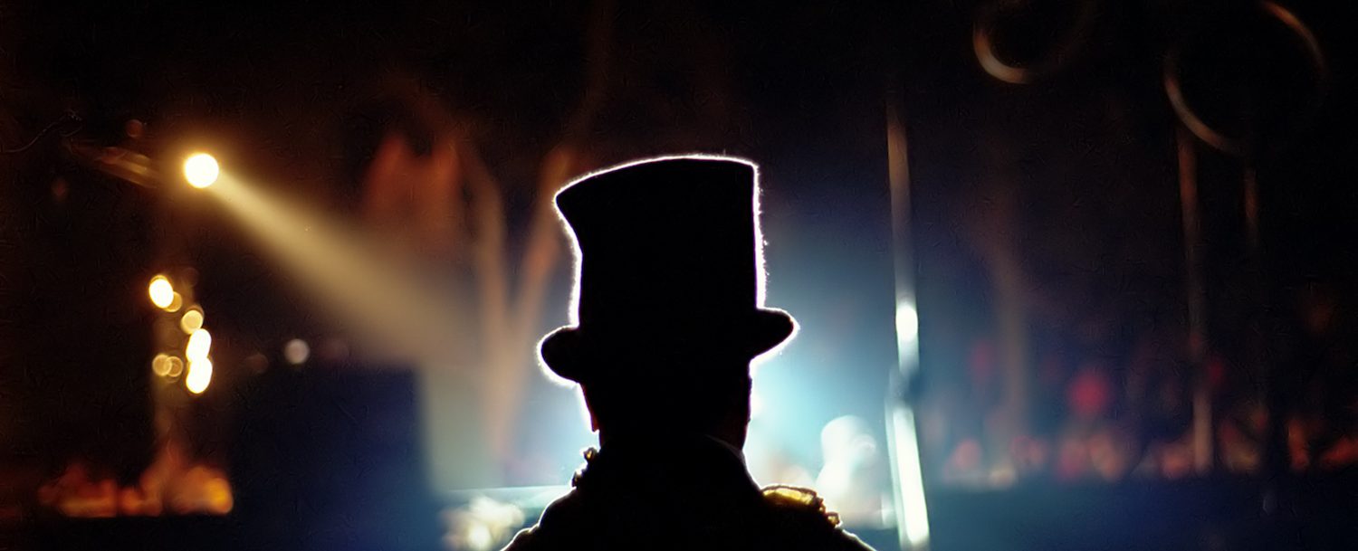 magician silhouette performing